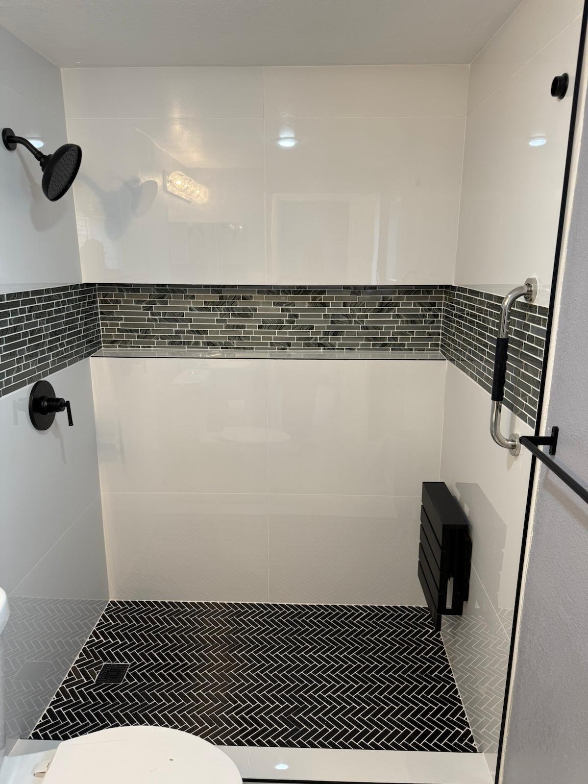 Completed black and white custom shower remodel